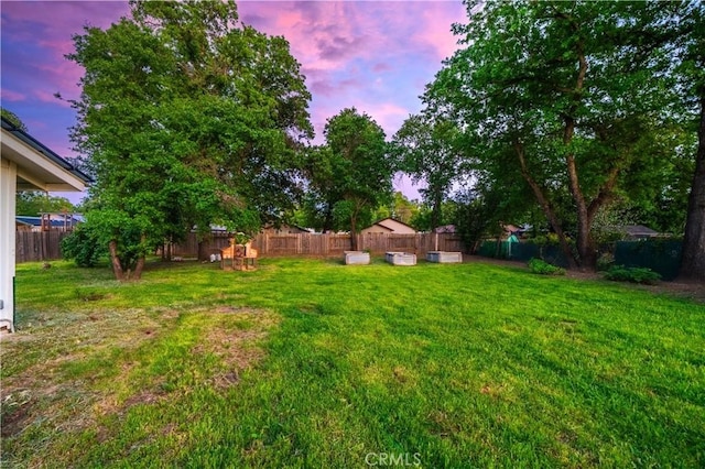 1711 Shasta St, Anderson, CA 96007 - yard at dusk featuring a fenced backyard