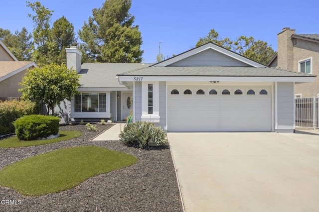 5217 Hillridge Dr, Camarillo, CA 93012 - ranch-style house with concrete driveway, a chimney, an attached garage, and a shingled roof
