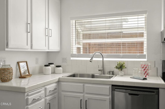 5217 Hillridge Dr, Camarillo, CA 93012 - kitchen with dishwasher, white cabinets, tile counters, and decorative backsplash