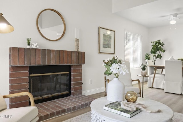 5217 Hillridge Dr, Camarillo, CA 93012 - living room featuring wood finished floors, a brick fireplace, and ceiling fan