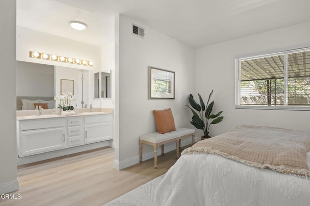 5217 Hillridge Dr, Camarillo, CA 93012 - bedroom featuring light wood-type flooring and ensuite bathroom