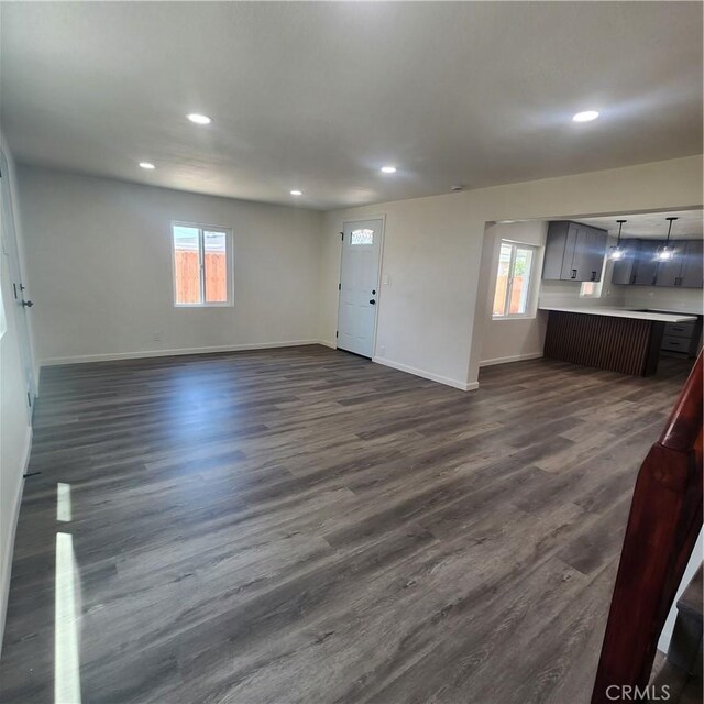 3087 N Lugo Ave, San Bernardino, CA 92404 - unfurnished living room with recessed lighting and dark wood finished floors