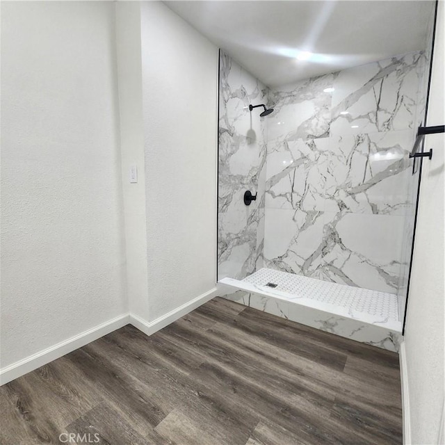 3087 N Lugo Ave, San Bernardino, CA 92404 - bathroom featuring a marble finish shower and wood finished floors