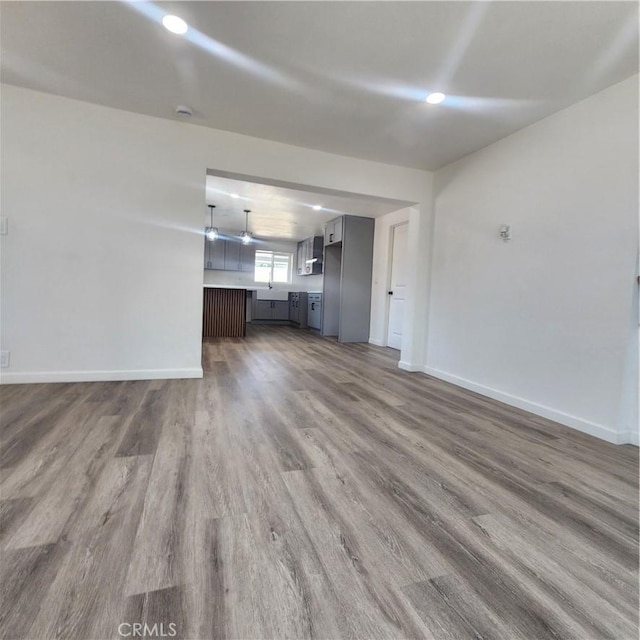 3087 N Lugo Ave, San Bernardino, CA 92404 - unfurnished living room with wood finished floors and recessed lighting