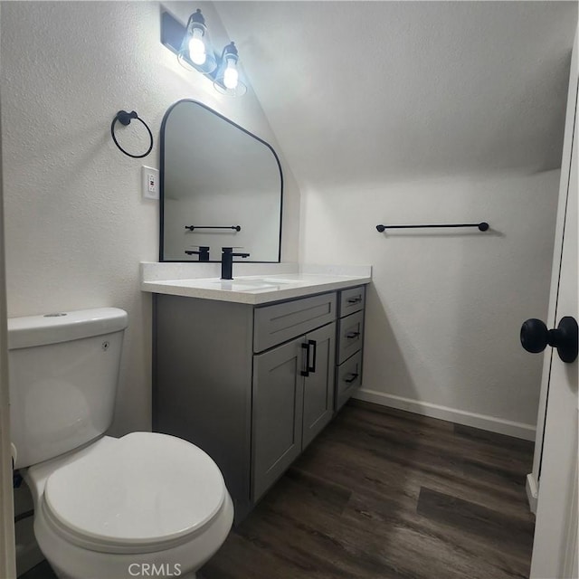 3087 N Lugo Ave, San Bernardino, CA 92404 - bathroom with vanity, wood finished floors, and vaulted ceiling