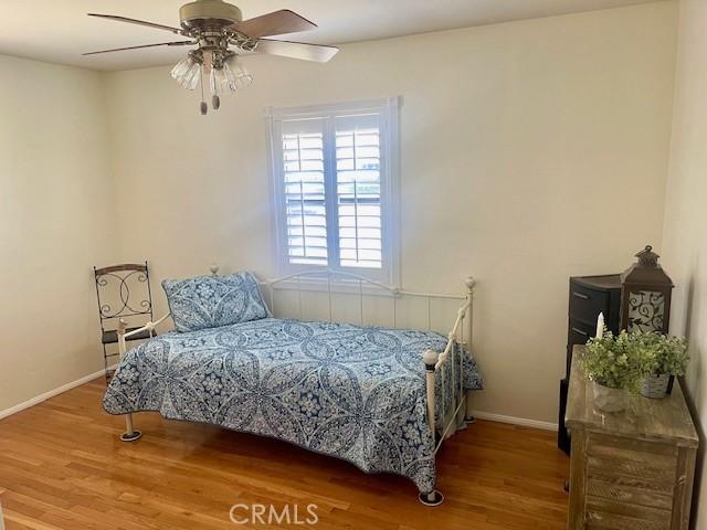 15343 Leahy Ave, Bellflower, CA 90706 - bedroom with wood finished floors and ceiling fan