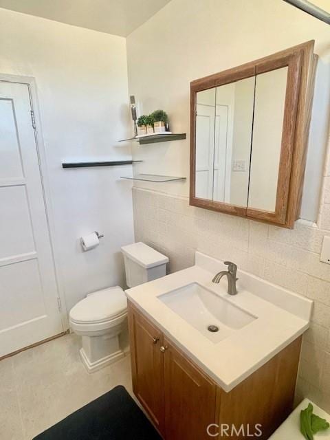 15343 Leahy Ave, Bellflower, CA 90706 - bathroom with vanity and tile walls