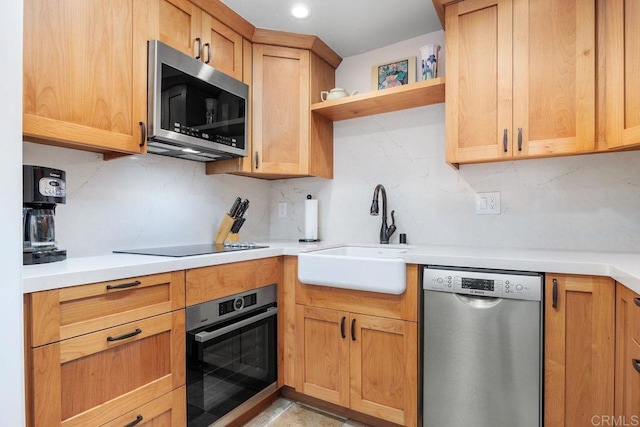 1560 Circa Del Lago Unit D204, San Marcos, CA 92078 - kitchen with appliances with stainless steel finishes, open shelves, backsplash, and light countertops