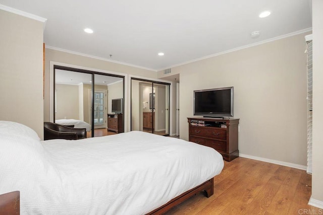 1560 Circa Del Lago Unit D204, San Marcos, CA 92078 - bedroom with light wood-style floors, recessed lighting, ornamental molding, and two closets