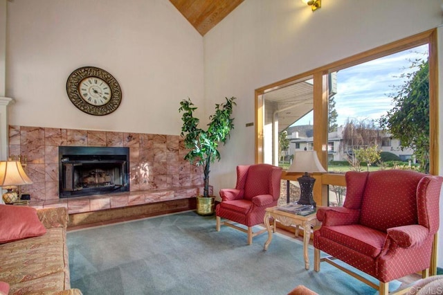 1560 Circa Del Lago Unit D204, San Marcos, CA 92078 - living area with carpet floors, a fireplace, wood ceiling, and high vaulted ceiling
