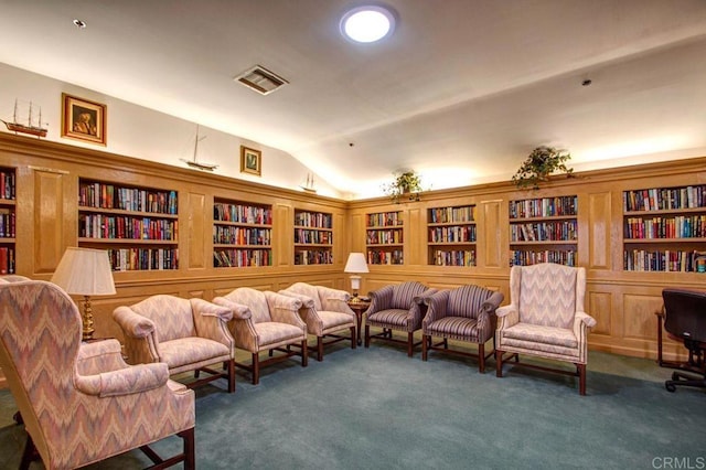 1560 Circa Del Lago Unit D204, San Marcos, CA 92078 - living area with wall of books, lofted ceiling, carpet, and built in features