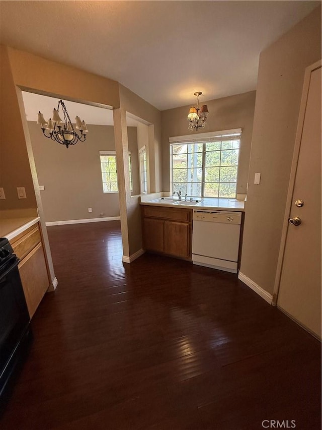 1767 Vasili Ln, Beaumont, CA 92223 - kitchen with a chandelier, white dishwasher, light countertops, black electric range oven, and dark wood-style flooring