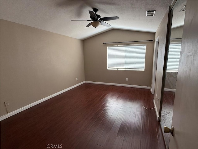 1767 Vasili Ln, Beaumont, CA 92223 - empty room featuring a ceiling fan, wood finished floors, lofted ceiling, and a textured ceiling