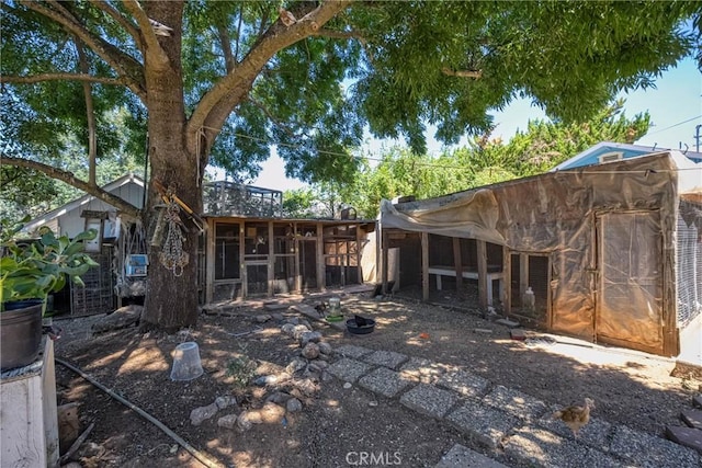 16374 35th Ave Unit 2, Clearlake, CA 95422 - rear view of house with exterior structure and an outdoor structure