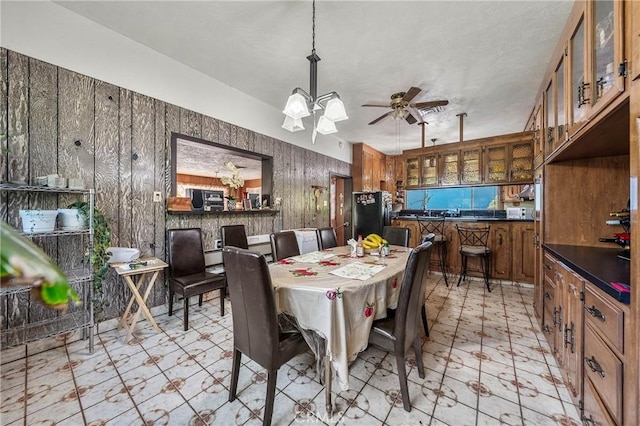 16374 35th Ave Unit 2, Clearlake, CA 95422 - dining space with light flooring, a chandelier, and ceiling fan