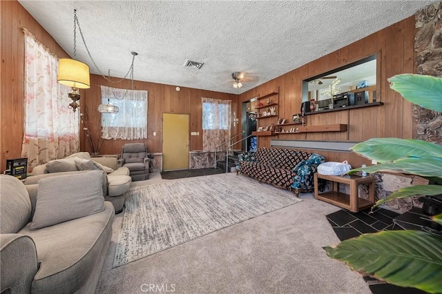 16374 35th Ave Unit 2, Clearlake, CA 95422 - carpeted living area with wooden walls and a textured ceiling