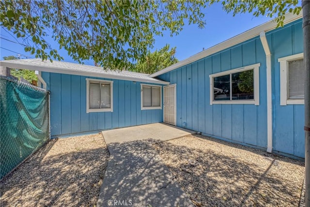 16374 35th Ave Unit 2, Clearlake, CA 95422 - view of side of home with board and batten siding and a patio area