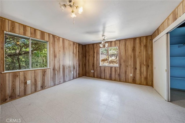 16374 35th Ave Unit 2, Clearlake, CA 95422 - spare room featuring wood walls, a ceiling fan, and tile patterned floors