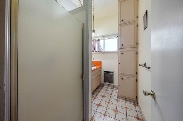 16374 35th Ave Unit 2, Clearlake, CA 95422 - bathroom featuring vanity, heating unit, and a shower