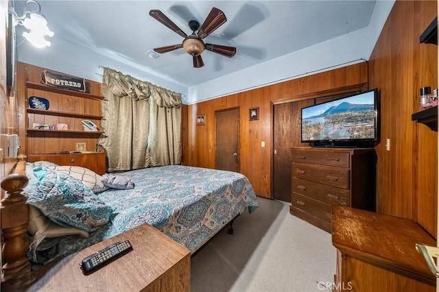 16374 35th Ave Unit 2, Clearlake, CA 95422 - carpeted bedroom with wooden walls and ceiling fan