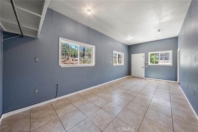 16374 35th Ave Unit 2, Clearlake, CA 95422 - spare room with tile patterned floors and baseboards