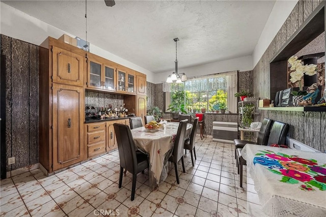 16374 35th Ave Unit 2, Clearlake, CA 95422 - dining space featuring a chandelier, a textured ceiling, and light floors