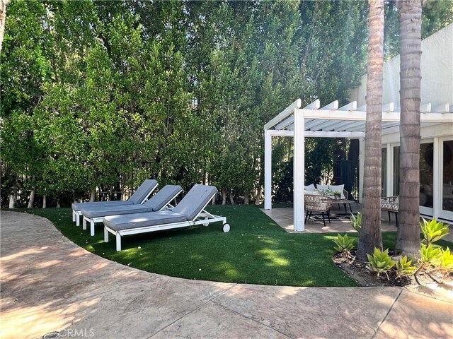16815 Bajio Rd, Encino, CA 91436 - view of green lawn with a patio area and a pergola
