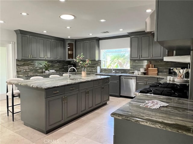 16815 Bajio Rd, Encino, CA 91436 - kitchen featuring dishwasher, stone counters, gray cabinets, tasteful backsplash, and recessed lighting