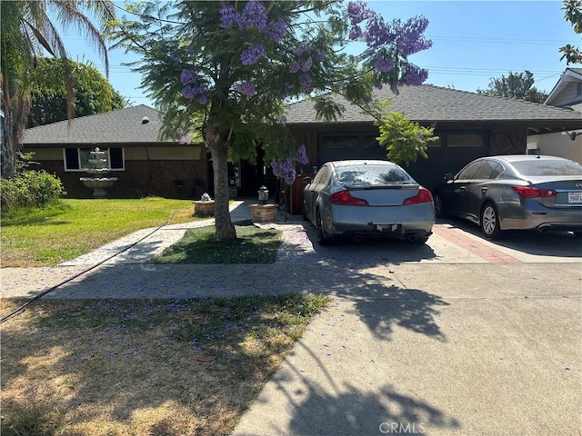 225 N Malena Dr, Orange, CA 92869 - ranch-style home with concrete driveway, an attached garage, and a shingled roof