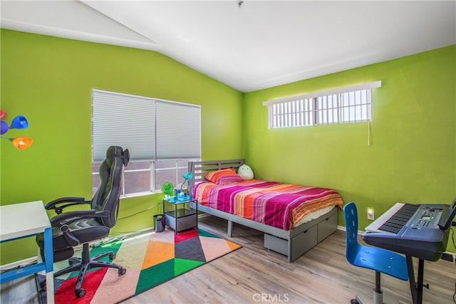 25545 Prospect Ave, Loma Linda, CA 92354 - bedroom featuring vaulted ceiling, wood finished floors, and a desk