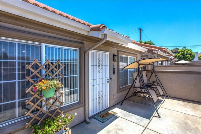 25545 Prospect Ave, Loma Linda, CA 92354 - entrance to property with a tile roof and a patio area