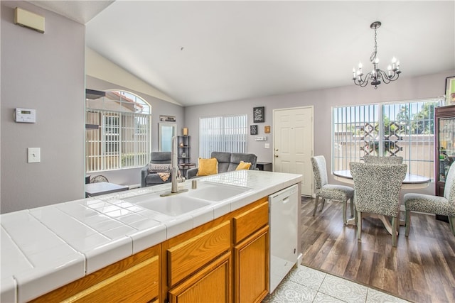 25545 Prospect Ave, Loma Linda, CA 92354 - kitchen with dishwasher, vaulted ceiling, plenty of natural light, a chandelier, and open floor plan