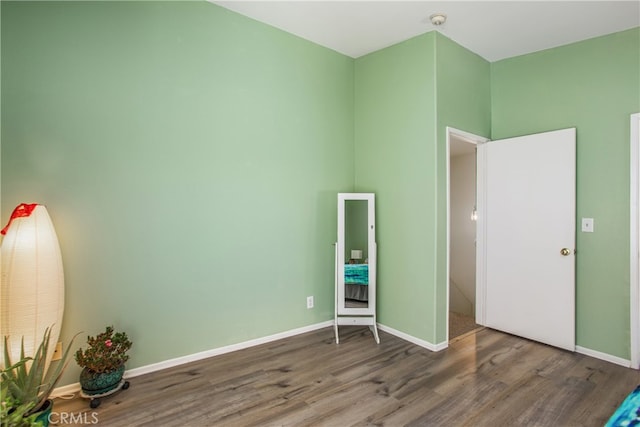 25545 Prospect Ave, Loma Linda, CA 92354 - unfurnished bedroom featuring wood finished floors and baseboards