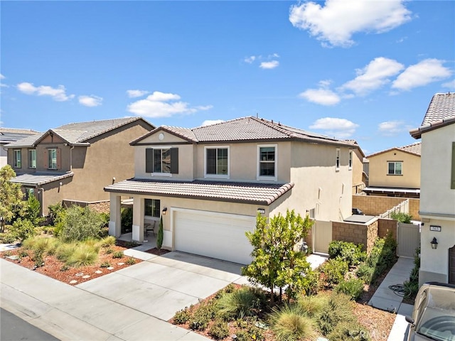 571 E Alru Ave, Rialto, CA 92376 - mediterranean / spanish-style house with stucco siding, a tiled roof, driveway, a garage, and a gate
