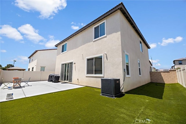 571 E Alru Ave, Rialto, CA 92376 - rear view of property with a fenced backyard, a patio area, and stucco siding
