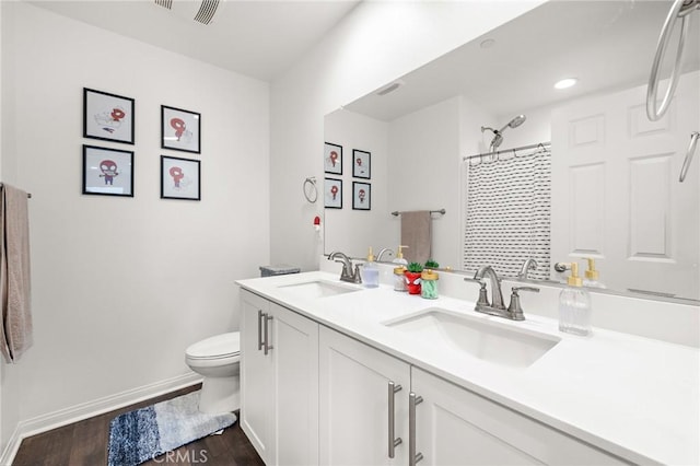 571 E Alru Ave, Rialto, CA 92376 - bathroom featuring double vanity, wood finished floors, curtained shower, and recessed lighting