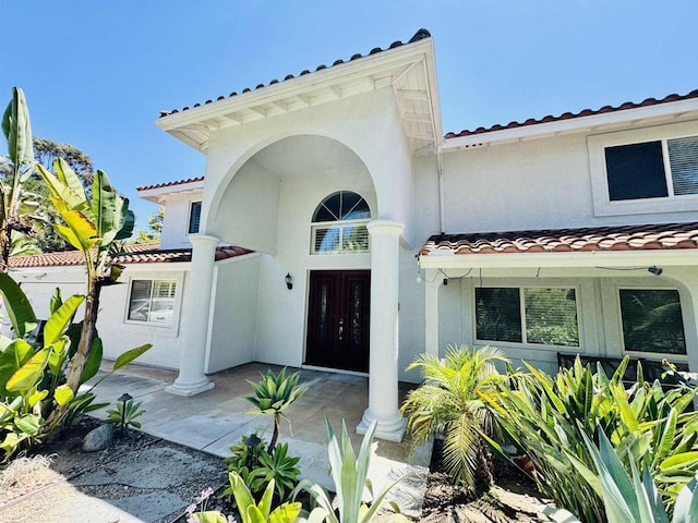 15696 Oakstand Rd, Poway, CA 92064 - property entrance featuring a tiled roof, stucco siding, and french doors