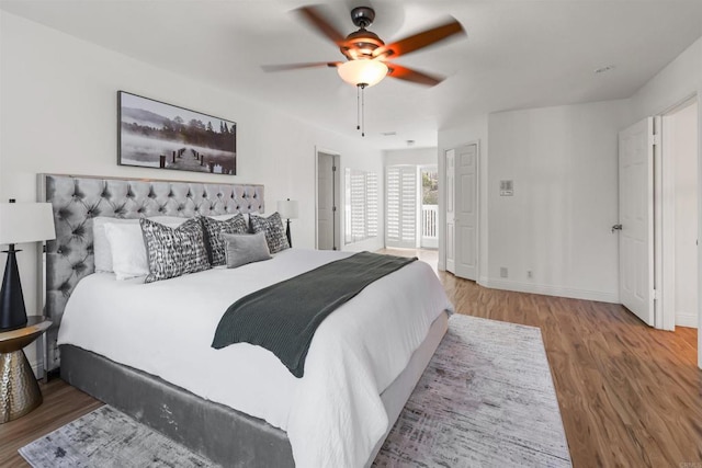 15696 Oakstand Rd, Poway, CA 92064 - bedroom with wood finished floors and a ceiling fan