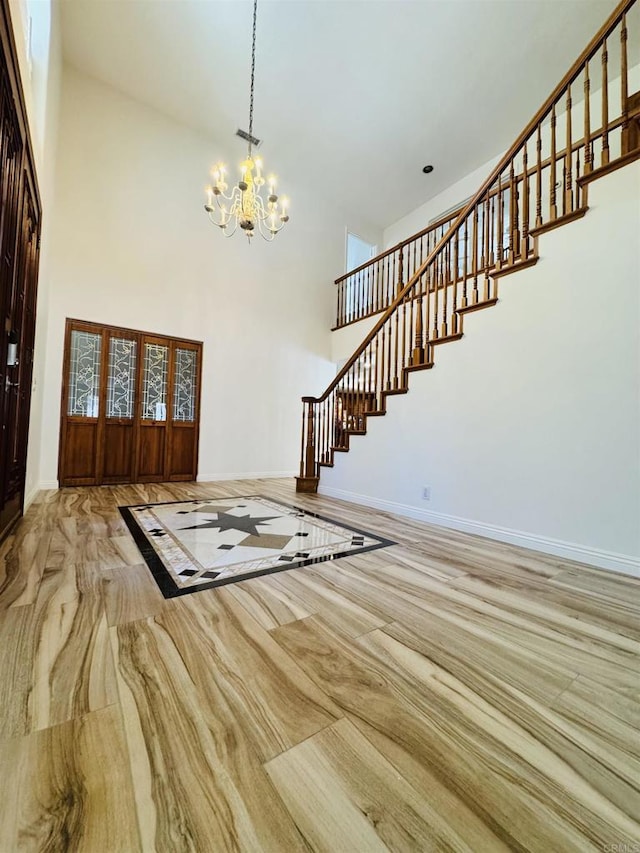 15696 Oakstand Rd, Poway, CA 92064 - foyer entrance with a towering ceiling, a chandelier, and stairs