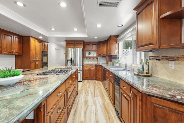 15696 Oakstand Rd, Poway, CA 92064 - kitchen featuring stainless steel appliances, a raised ceiling, light stone countertops, decorative backsplash, and recessed lighting