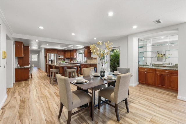 15696 Oakstand Rd, Poway, CA 92064 - dining room featuring crown molding, light wood-type flooring, and recessed lighting