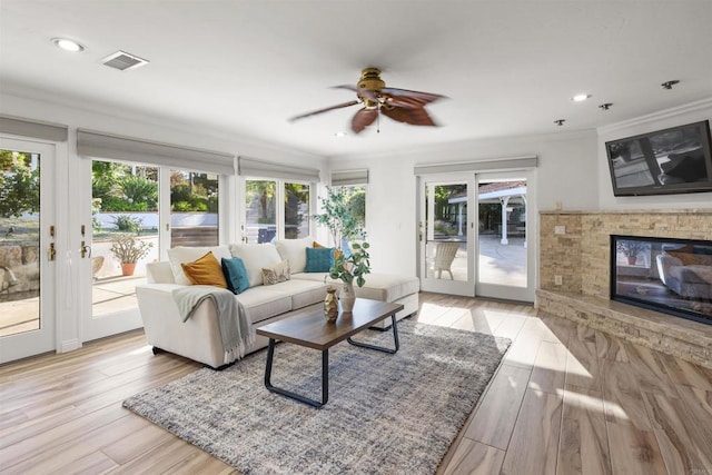 15696 Oakstand Rd, Poway, CA 92064 - living room featuring ceiling fan, ornamental molding, recessed lighting, light wood-type flooring, and a glass covered fireplace