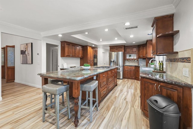 15696 Oakstand Rd, Poway, CA 92064 - kitchen featuring appliances with stainless steel finishes, open shelves, a kitchen breakfast bar, a tray ceiling, and a center island