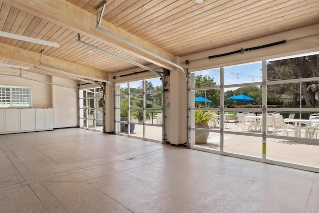 7133 Linden, Carlsbad, CA 92011 - spare room with speckled floor and a wooden ceiling with exposed beams