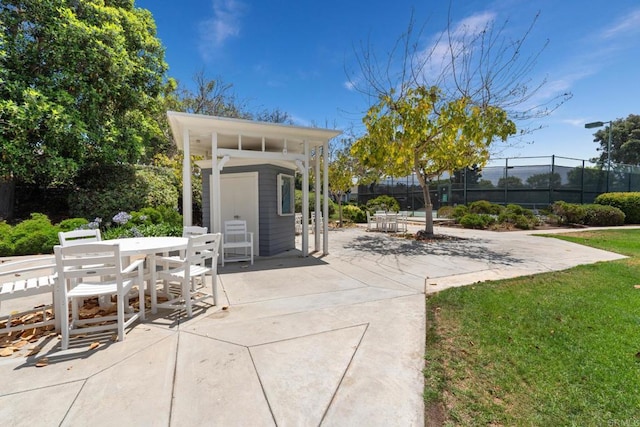 7133 Linden, Carlsbad, CA 92011 - view of patio featuring outdoor dining space and an outbuilding