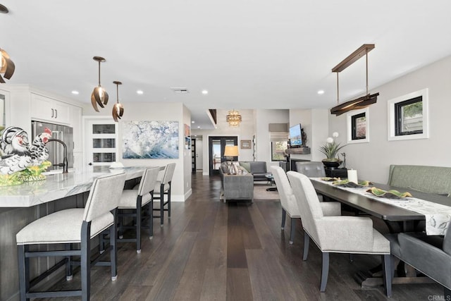 7133 Linden, Carlsbad, CA 92011 - dining area featuring dark wood-style floors, recessed lighting, and plenty of natural light