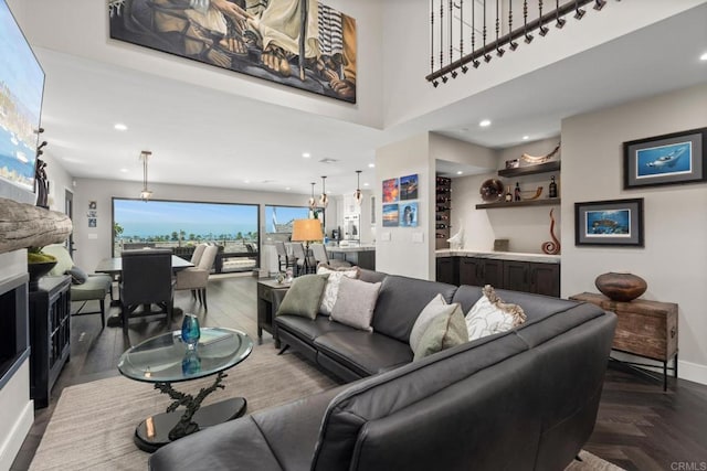 7133 Linden, Carlsbad, CA 92011 - living area featuring baseboards and bar