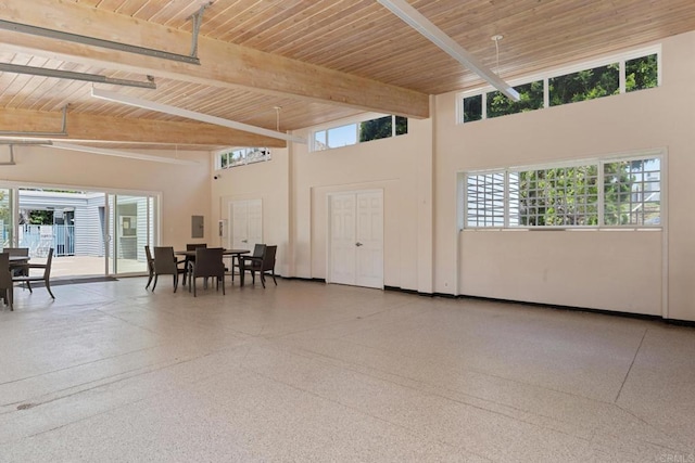 7133 Linden, Carlsbad, CA 92011 - dining area with a wooden ceiling with exposed beams, a towering ceiling, plenty of natural light, and speckled floor