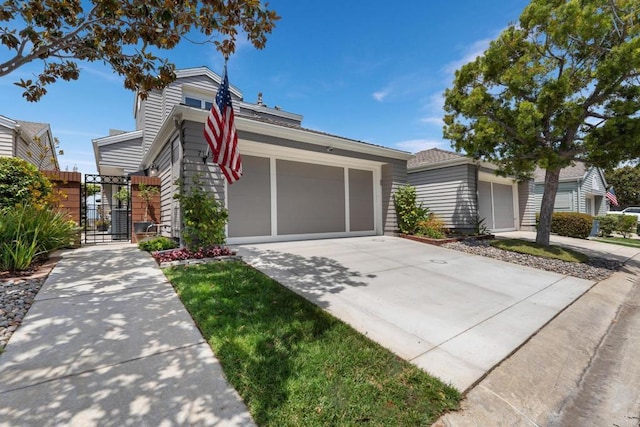 7133 Linden, Carlsbad, CA 92011 - view of front of home with a gate, driveway, and a garage