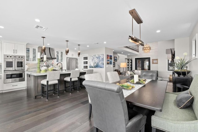 7133 Linden, Carlsbad, CA 92011 - dining area with recessed lighting and dark wood-style flooring